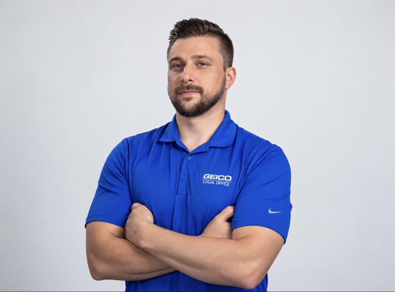Matthew Crampton, Saugus GEICO local agent, wearing a blue GEICO Local Office shirt